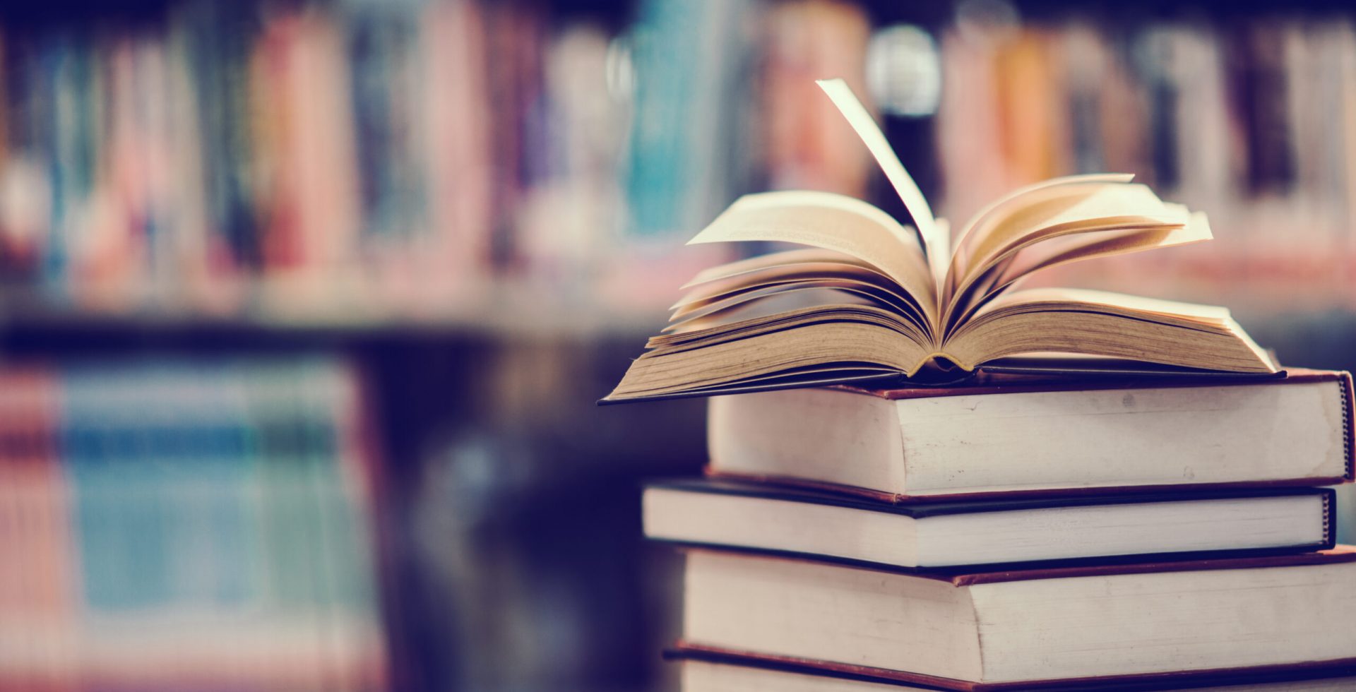 Book in library with open textbook,education learning concept